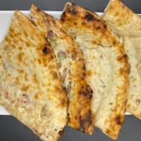 Onion Kulcha Naan · Traditional Naan stuffed with finely chopped onions and baked in oven