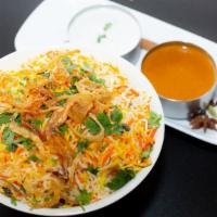Goat Biryani · Succulent Goat pieces with bone cooked in curry sauce and mixed with flavored basmati rice. ...