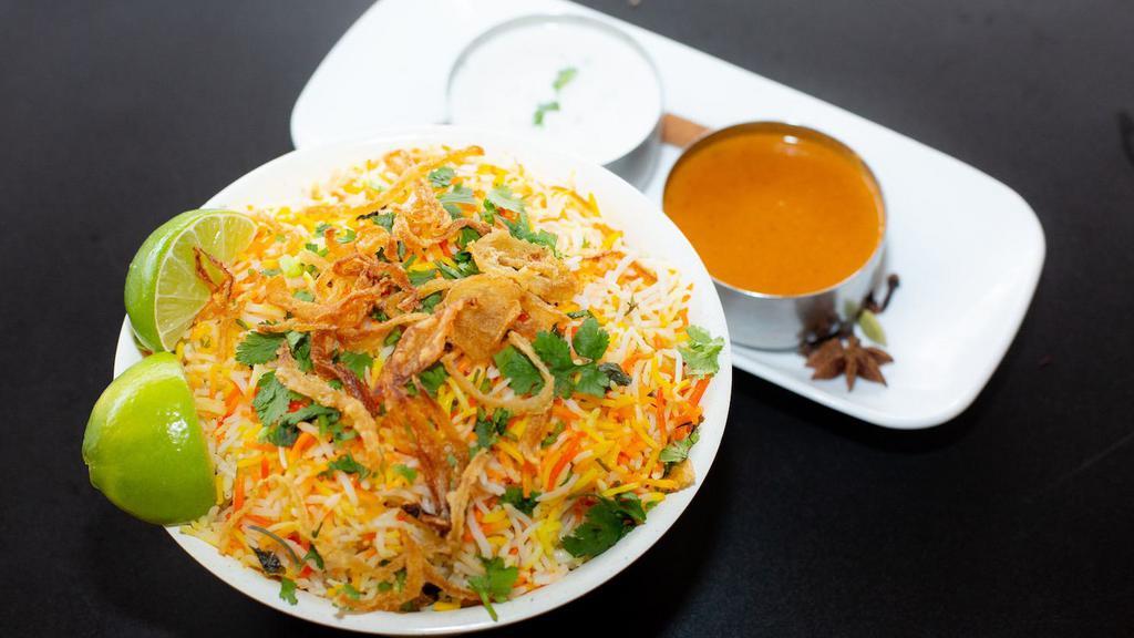 Shrimp Biryani · Peeled Shrimp tossed in curry sauce flavored with spices and mixed with flavored basmati rice. Served with raita and salan. Allergy Indicators: Dairy