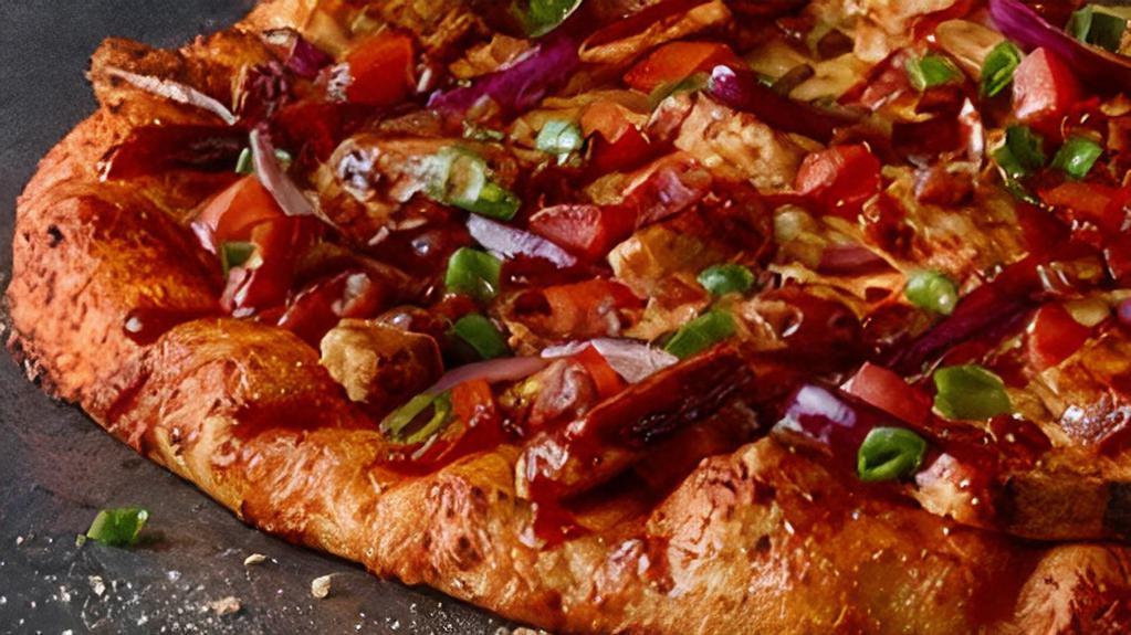 Bbq Chicken · Backyard BBQ Meets. Handmade Pizza Grilled white meat chicken, bacon, cheddar, tomatoes, red & green onions, sweet & tangy BBQ sauce.