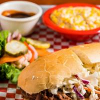 Chopped Brisket Sandwich · Topped with coleslaw, house BBQ sauce, French roll.