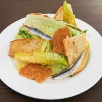 Classic Caesar Salad · Hearts of Romaine, Classic Caesar Dressing, Boquerones, Parmesan Frico