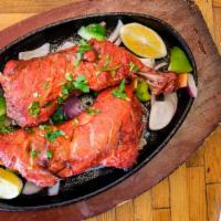 Chicken Tandoori · Two chicken legs cooked in clay oven.