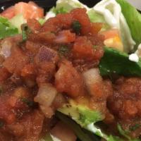 43. Taco Salad · Hard shell flour tortilla with beans, lettuce, tomatoes and avocado.