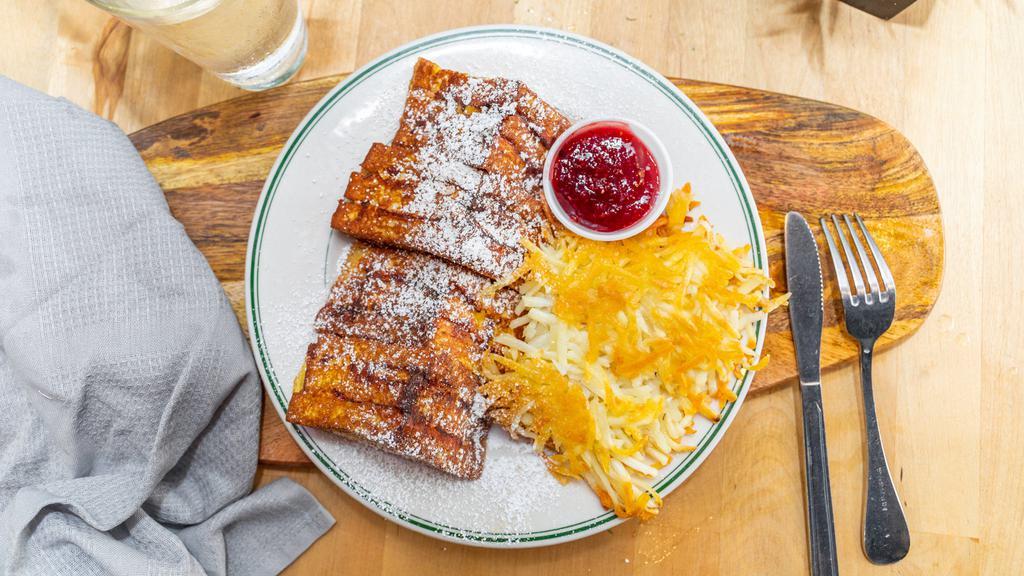 Monte Cristo · turkey, ham, havarti and cheddar cheeses, bread dipped in egg and grilled with raspberry jam and  powdered sugar.  served with home fries.