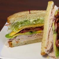 Turkey Club Sandwich · Oven-roasted turkey, bacon, avocado, American cheese on toasted, sliced sourdough with mayon...