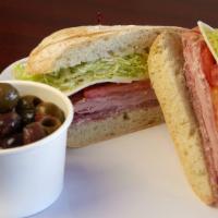 Italian Sandwich · Prosciutto, mortadella, salami, provolone on a soft roll with italian dressing, lettuce, and...