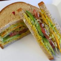 Veggie Sandwich · Choice of cheese, avocado, on whole wheat with mustard, lettuce, tomato, pickle, onion, and ...