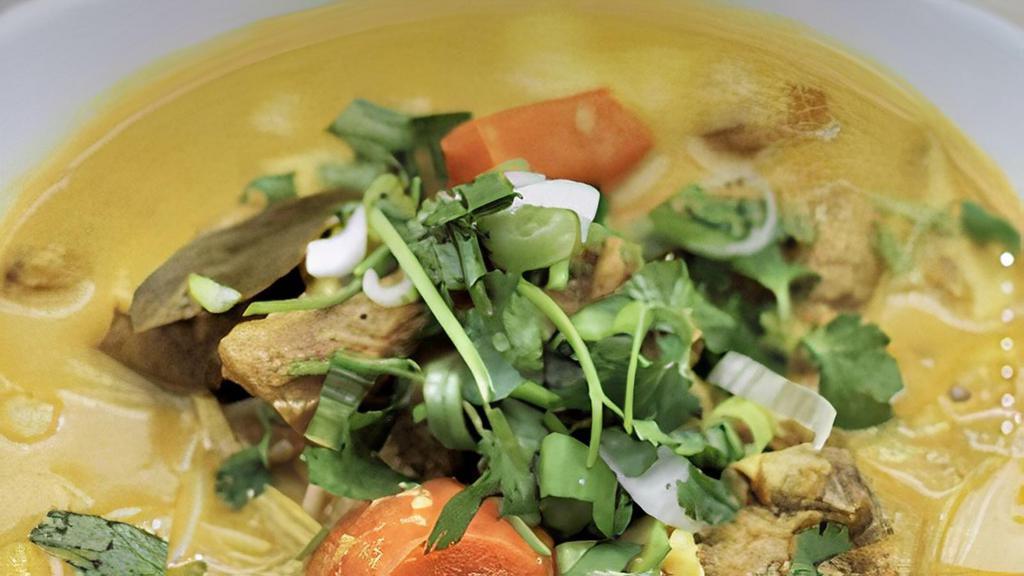 9. Curry Chicken with Vermicelli noodles Soup · chicken marinated with curry,, sweet potato, carrot cooked with coconut milk.served with bean sprouts, basil or cilantro and lime