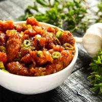 Authentic Chicken Manchurian · Spicy chicken pieces steamed formed into deep fried dumplings.