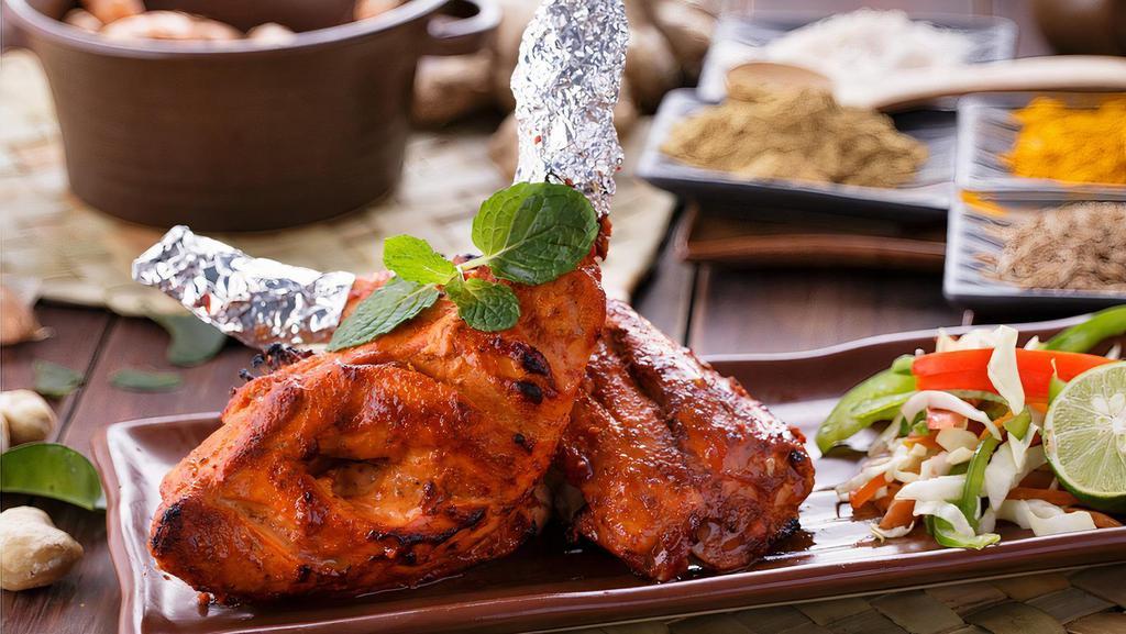 Grilled Tandoori Chicken (Half) · Gluten-free. Half spring chicken marinated overnight in yogurt, spices, and fresh herbs.