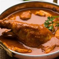 Traditional Chicken Curry · Delightful chicken stewed in onion tomato based sauce flavored with ginger, garlic, pepper, ...