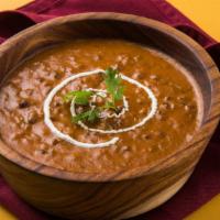 Traditional Daal Makhani · Tasty lentil curry tempered with ghee fried spices and herbs.