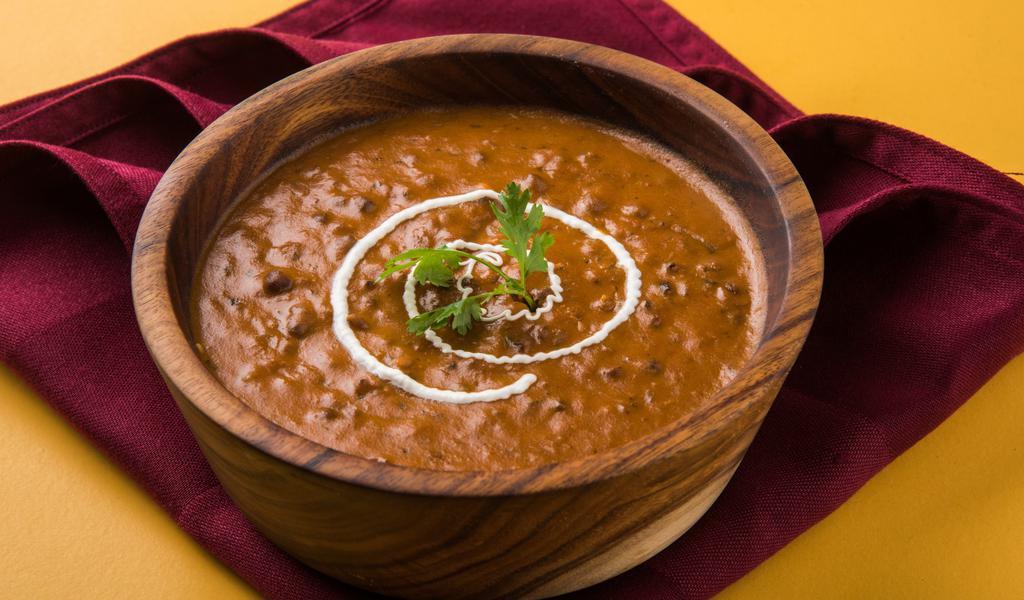 Traditional Dal Makhani · Tasty lentil curry tempered with ghee fried spices and herbs