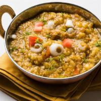 Delhi Style Baigan Bharta · Fire roasted eggplant mash cooked in spices