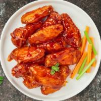 Bully Buffalo Chicken Wings · Fresh chicken wings fried until golden brown, and tossed in buffalo sauce. Served with a sid...