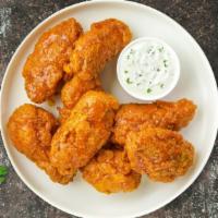 It Takes Two To Mango Habanero Wings · Fresh chicken fried until golden brown, and tossed in mango habanero sauce. Served with a si...