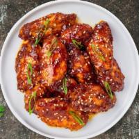 Terrific Teriyaki Wings · Fresh chicken wings fried until golden brown, and tossed in teriyaki sauce. Served with a si...