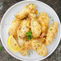 Boolean Garlic Parmesan Wings · Fresh chicken wings fried until golden brown, and tossed in garlic and parmesan. Served with...