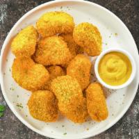 Chicken Nuggets League · Bite sized nuggets of chicken breaded and fried until golden brown. Served with your choice ...