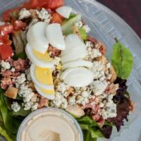 Small The Cobb · Roasted chicken, blue cheese, tomato, chopped egg, bacon and choice of dressing.