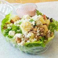 Small The Laurel · Fuji apple, candied walnuts, blue cheese and honey beet dressing.
