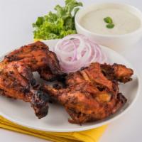 Tandoori Chicken · Chicken marinated in mint sauce & mild spice.