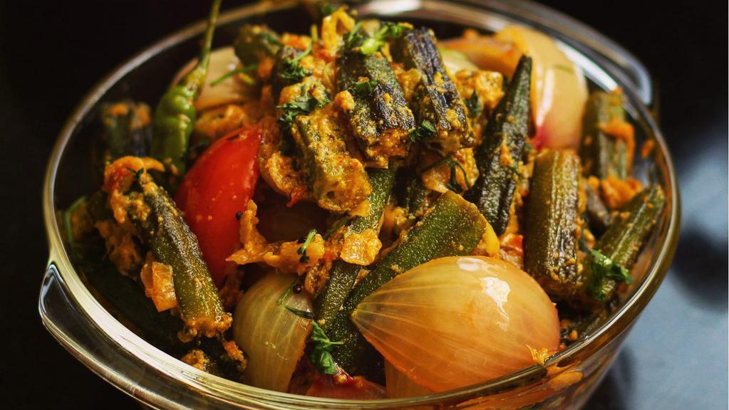 Bhindi-do-pyaza · Crispy fried okra seasoned with diced onions, tomatoes and spices.