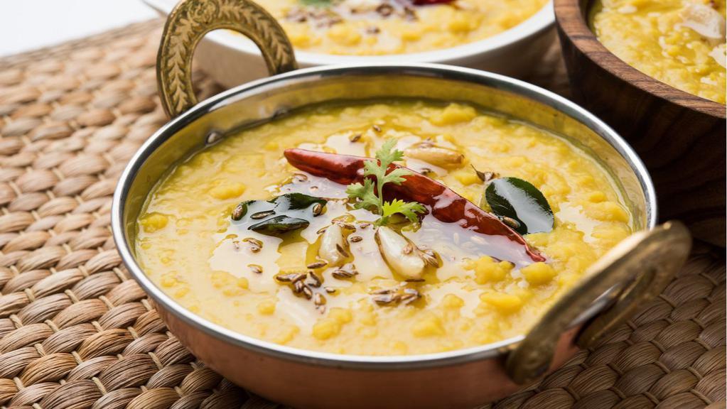 Punjabi Dal Tadka · Traditional organic yellow lentils flavored with desi tadka.