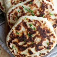 Stuffed Paneer Naan · Bread stuffed with cottage cheese. Available in whole wheat.
