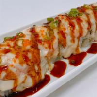 Lion King Roll · In: real crab & avocado.  Out:  baked salmon  with house special sauce