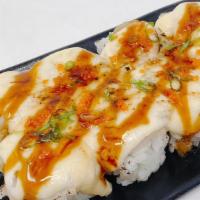 Scallop Island Roll · In: real crab & avocado.  Out:  baked scallop with house special sauce