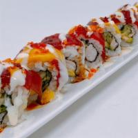 Mango Paradise Roll · In: Cooked shrimp, Cucumber & avocado Out:  Tuna, Mango & Tobiko and special sauce