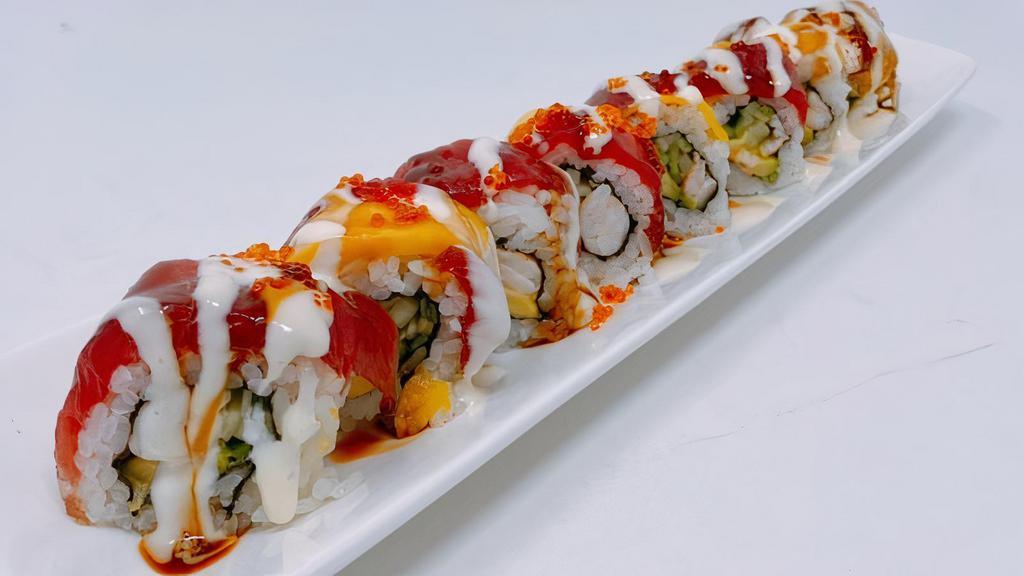 Mango Paradise Roll · In: Cooked shrimp, Cucumber & avocado Out:  Tuna, Mango & Tobiko and special sauce