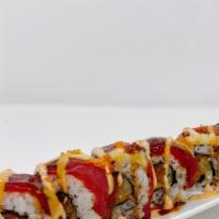Mango Tango Roll · Spicy.  In: Spicy Tuna, Mango & Cucumber. Out:  Tuna, Avocado & Tobiko with special sauce