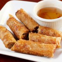 Imperial Rolls · Crispy fried rolls with ground pork, taro, carrots, and silver noodles.