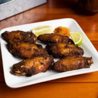 Fried Chicken Wings · Marinated with house special sauce. 6 pieces.