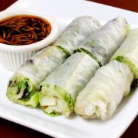 Veggie Summer Rolls · Soft rice paper rolls filled with silver noodles, bean sprouts, lettuce, and mint leaves.