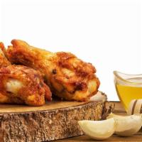 Honey Garlic Chicken Wings · Fresh chicken wings topped in honey garlic sauce.