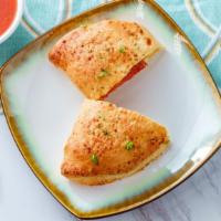 Cheese Calzone · A blend of cheese and sauce inside the calzone. With a choice of cheese required.