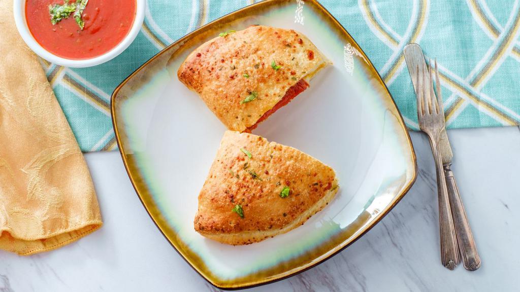Cheese Calzone · A blend of cheese and sauce inside the calzone. With a choice of cheese required.