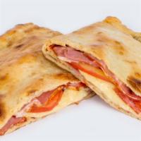 Classic Hawaiian Calzone · Pan baked thick pizza crust layered with turkey ham, pineapples and mozzarella cheese.