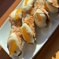 Cannoli (Regular) · A chocolate-coated pastry shell filled with a mix of ricotta, candied fruit and chocolate.