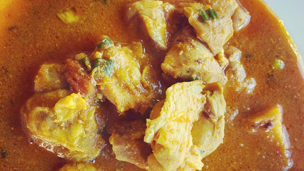 Chicken Curry · Tender chicken pieces cooked with homemade curry of tomatoes, onions, ginger and garlic.