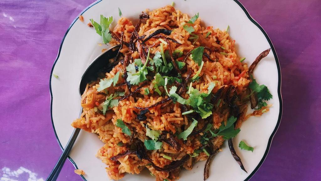 Chicken Biryani · Boneless chicken cooked with basmati rice and traditional Nepali spices.