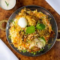 Hydrabadi Chicken Biryani · Spiced basmati rice, chicken, mint, onion, green cardamom, and ginger.