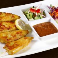 Chicken Satay · Chicken sliced and marinated on a skewer. Grilled and served with peanut cucumber sauce.