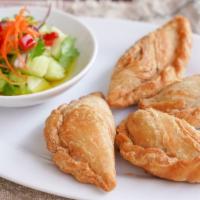 Thai Style Curry Puff · Deep-fried pastry shell with curry, carrots, potatoes, and onions. Choice chicken curry puff...