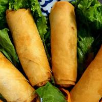 Egg Rolls  ( Vegetarian ) · Deep-fried wheat paper rolls stuffed with silver noodles, cabbage, Celary and carrot served ...