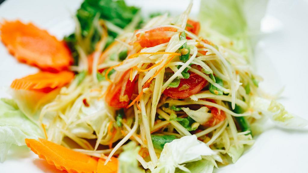 Som Tom ( Papaya Salad ) with Sticky rice · Papaya salad. Green papaya,  carrot , green bean, tomatoes, lime juice, and ground peanut. Served with fresh vegetables and sticky rice.
